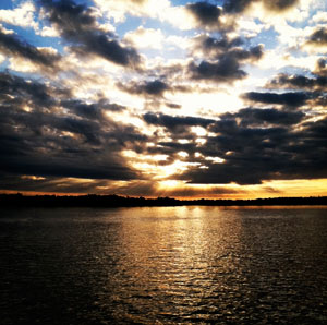 A picturesque sunrise on the water.